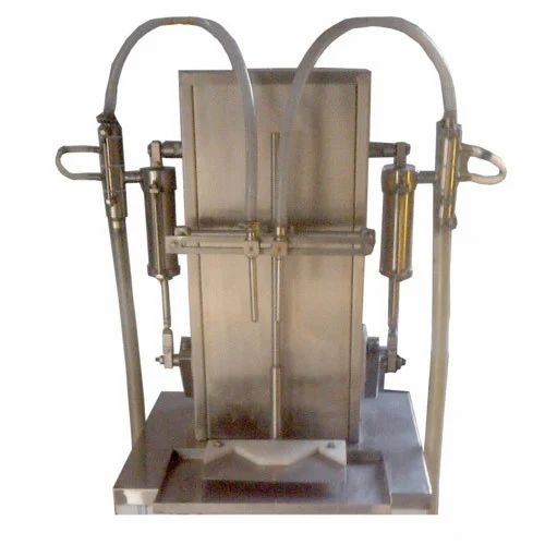 Volumetric bottle filling machine