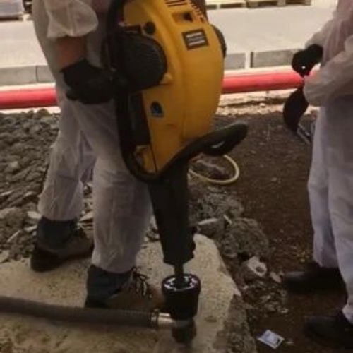 Handheld petrol rock drilling