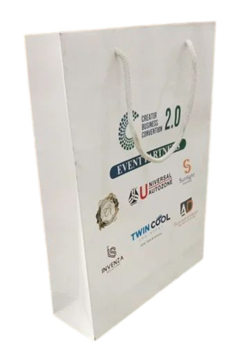 White Printed Paper Bag - Kraft Paper, Customized Size, White, Patch Handle | Durable, Eco Friendly, Fine Finished, 1 Kg Load Capacity