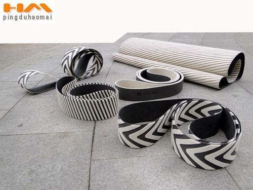 Qing Dao Jinwen-graphite coated canvas,pressure segmented belts,wide  segmented pressure belts,pressure chevron belts,graphite sliding  liners,sponge wheel