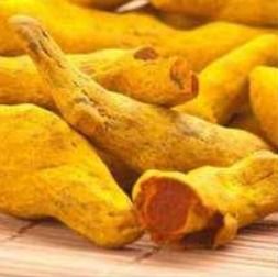 Turmeric Powder And Fingers