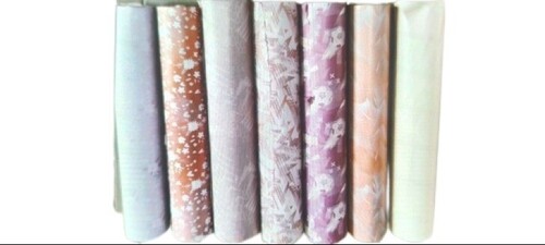 टेबल पेपर रोल और फैब्रिक शीट