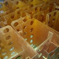Capacitors with sheet metal connectors