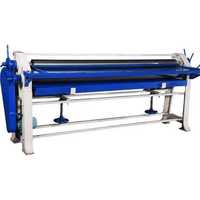 Sheet pasting machine